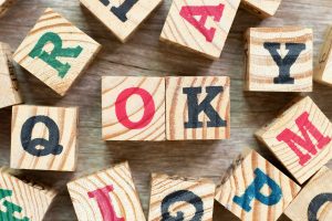 Wooden blocks read "OK." This reflects concepts discussed in marriage counseling in Colorado Springs Colorado with Altitude Counseling.