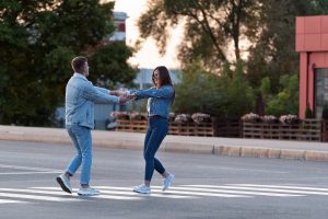 A couple is in the street. This relates to concepts of childhood emotional neglect in Colorado Springs, CO. Our therapists in Colorado Springs, CO are happy to help you improve your mental health and live your best life.