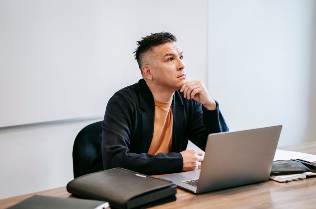Man deep in thought, illustrating the internal experience of loss explored in grief counseling for men in Colorado Springs, CO.