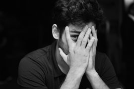 Man appearing worried and tense, illustrating chronic anxiety and emotional overwhelm explored in anxiety therapy for men in Colorado Springs, CO.