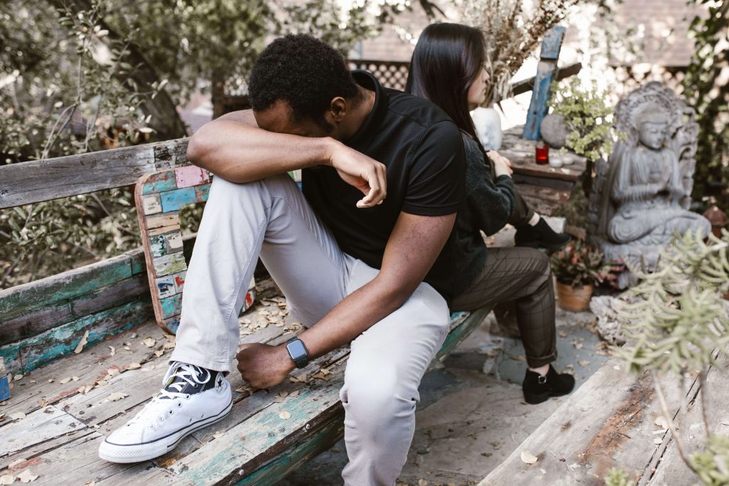 Man appearing stressed while experiencing relationship difficulties, illustrating how anxiety can lead to emotional withdrawal and conflict addressed through anxiety counseling for men in Colorado Springs, CO.