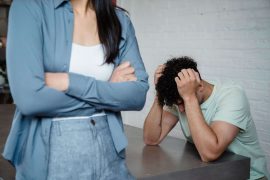 Man looking stressed during a difficult moment in his relationship, representing the emotional patterns explored through anxiety counseling for men in Colorado Springs, CO.