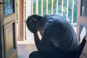 Man appearing depressed, representing the emotional challenges addressed with a depression therapist in Colorado Springs, CO.