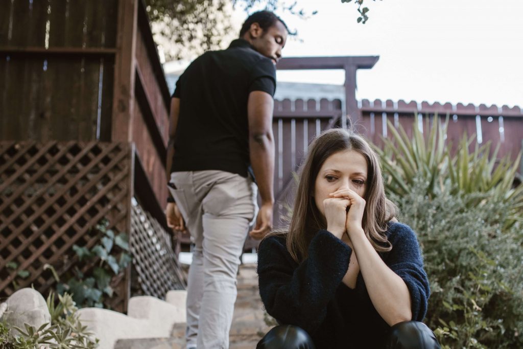 Couple separating after the end of their relationship, reflecting the life transition explored through therapy for divorce in Colorado Springs, CO.