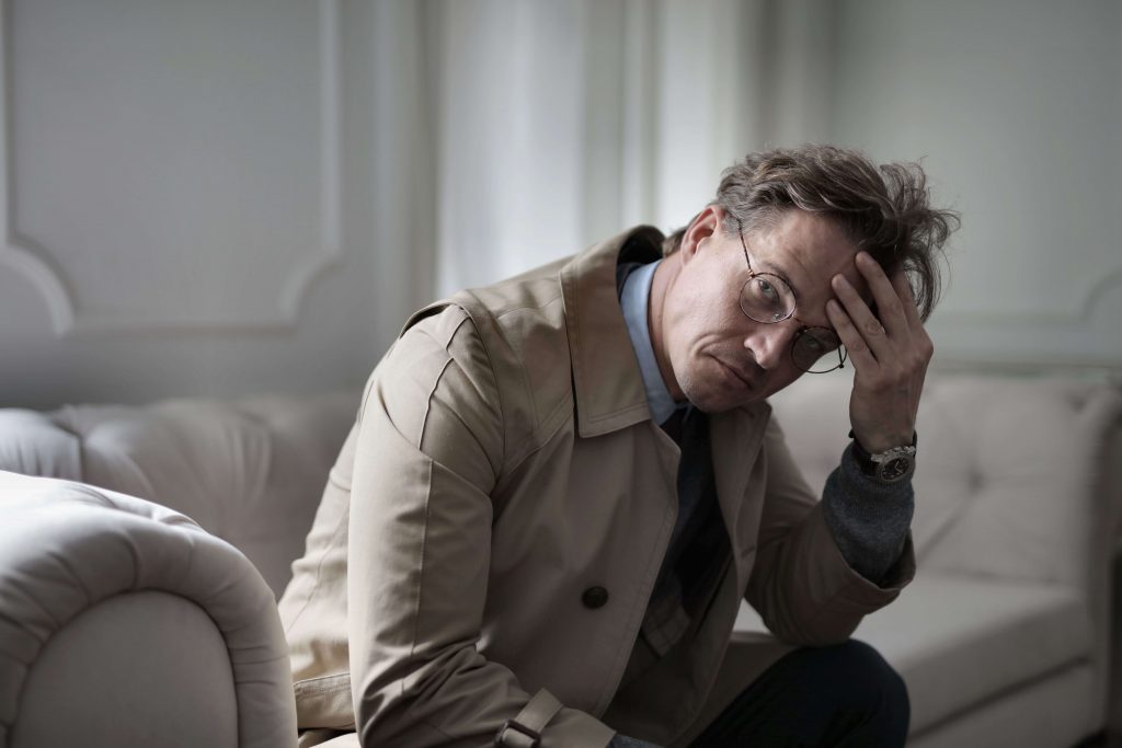Feeling Isolated - men’s therapy colorado springs co - therapy for men colorado springs co - therapist for men colorado springs co - colorado Man appearing thoughtful and isolated, representing the loneliness that can come from feeling like you have to handle everything alone and may benefit from men's therapy in Colorado Springs, CO.